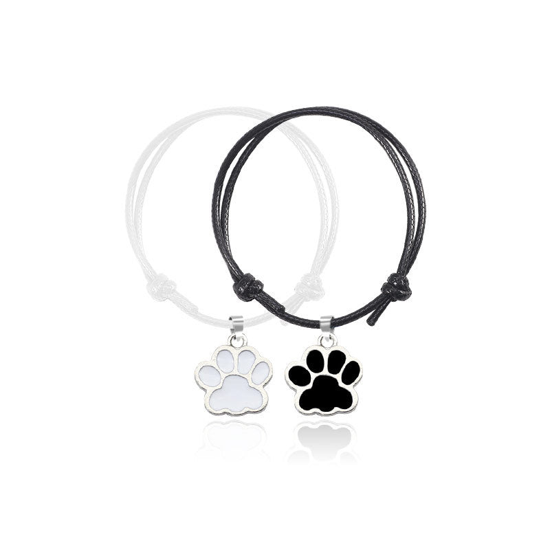 Adjustable Cord Bracelet with Black and White Dog Paw Charms